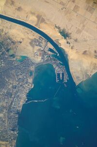 Satellite view of the port and city, the southern terminus of the Suez Canal that transits through Egypt and debouches into the Mediterranean Sea near Port Said. (Up is north-east).