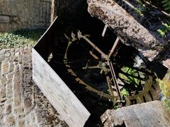 Photograph of the water wheel of Chez Lyonnet mill in operation.