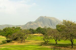Aso Rock as seen from the IBB golf course in Abuja, Nigeria.jpg