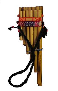 A siku pan flute with two rows of bamboo pipes cut to graduated lengths. The pipes are aligned so that their tops are level (for embouchure). The pipes are bound in a combination of braided and woven yarn, including a woven strap with a traditional pattern. An additional strap is attached to the left and right sides of the flute, so that it may be worn around th neck.