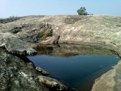 Deep Cistern on hilltop of Bodhikonda.jpg