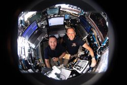 NASA astronauts Kjell Lindgren and Bob Hines monitor Starliner (iss067e065648).jpg