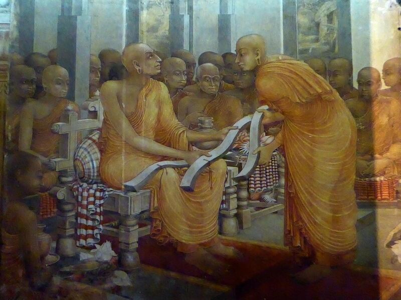 File:Buddhaghosa with three copies of Visuddhimagga.jpg