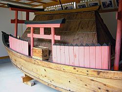 A reproduction of a sealed wooden boat.
