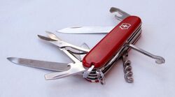 Folding pocket knife with multiple exposed tools