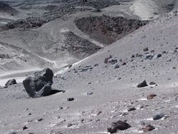 Isolated boulders resting on a steep slope