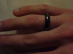 A smooth circular band of magnetite on a finger