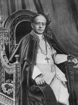 A seated Pope Pius XI