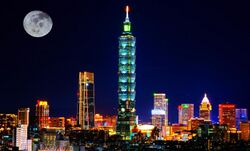 Taipei skyline cityscape at night with full moon.jpg