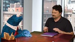 Double Fine founder Tim Schafer (right) and Cookie Monster (left) during a promotional video for Sesame Street: Once Upon a Monster