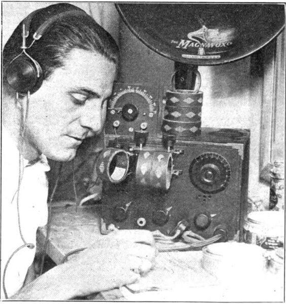File:Man listening to regenerative receiver 1922.jpg