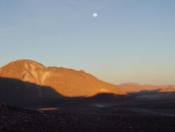 The moon high above Cerro Chajnantor at sunset.jpg