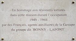 Commemorative plaque with the inscription "In hommage to Resistance members tortured in this house during the occupation 1940-1944, by French agents of the Gestapo from the group known as "Bonny-Lafont"