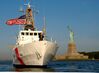 US Navy 030828-C-5313L-543 U.S. Coast Guard Cutter Bainbridge Island (WPB 1343), home ported in Sandy Hook, NJ., stands watch over the Statue of Liberty in New York Harbor.jpg
