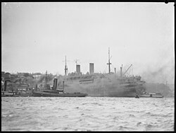 Ship and Tugs Sydney 1942 slnsw.jpg