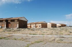 Boarded-up abandoned housing in Jeffrey City, Wyoming.jpg