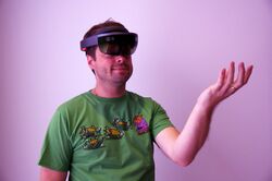 Photograph of a man wearing an augmented reality headset