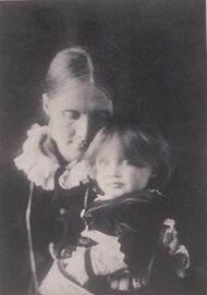 Photo of Julia Stephen with Virginia on her lap in 1884