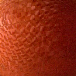 A close-up of a textured orange ball