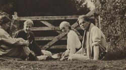 Group of neopagans, Noel Olivier; Maitland Radford; Virginia Woolf; Rupert Brooke, sitting in front of a farm gate on Dartmoor in August 1911