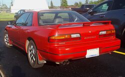 1993 Nissan 240SX LE in Aztec Red, Rear Left, 07-06-2019.jpg