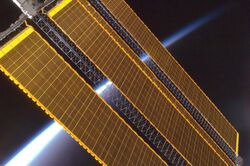 Earth horizon and International Space Station solar panel array (Expedition 17 crew, August 2008).jpg