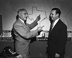Dr. Alexander L. Sheff, left, president of Speedwriting Company, points out the pin that marks Fort Worth as one of 400 cities in which the alphabet-type of shorthand is offered.