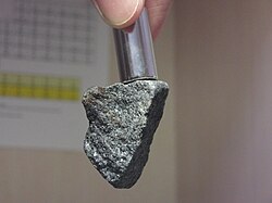 Magnetite sample with neodymium magnet.jpg