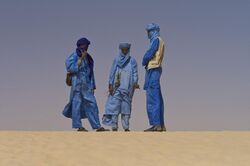 Group of Tuareg people in desert