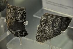 Fragments of a vessel dedicated to the temple of god Nergal. Shalmaneser III kneels before Nergal. From Nineveh, Iraq. The British Museum, London.jpg