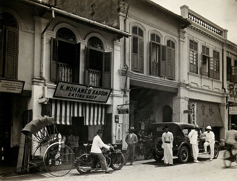 File:An arcade of shops with a road sweeper at work in the street of Kuala Lumpur, 1915-1925.jpg