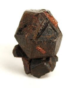 Hexagonal crystal, with a rough rusty surface