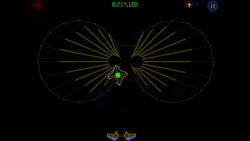 This screenshot from "Luxor Evolved" showcases it's fifth secret level, which is a reference to Tempest 2000. In this image, the playfield of the aforementioned game is used as the track for spheres to crawl along. The track itself consists of many yellow vector lines, arranged together in a formation that resembles two connected circles. A large number of lines within each circle come together at two points close to the center of the screen, one for each half of the board. An open pyramid rests just below the left centerpiece. The "winged scarab" sits at the bottom center of the picture, idle.