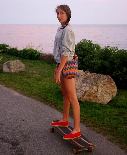 File:Girl riding her longboard in the sunset.jpg