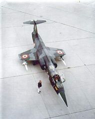 Italian F-104S parked on tarmac with underwing-mounted AIM-7 Sparrow missiles