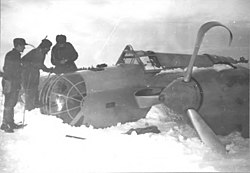 Swedish volunteers in the Winter War inspect a downed Tupolev SB.
