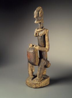 Brooklyn Museum 61.2 Figure of a Seated Musician Koro Player (2).jpg