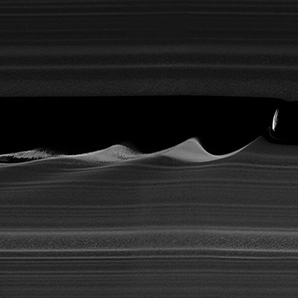 File:Daphnis makes waves - 4x vertical stretch.jpg
