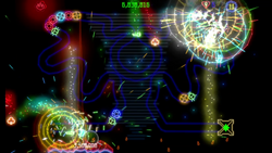 The image shown is a screenshot from the video game "Luxor Evolved". It shows a scene in the middle of gameplay featuring multiple explosions front and center caused by fireballs, with the player's "winged scarab" in the process of launching another fireball towards a chain of spheres. Treasures are also falling down towards the player, waiting to be collected. On the bottom of the screen, the player's scarab is, in contrast to it's usual muted yellow color, instead colored a bright red, taking up around one-third of the space on the screen. Very small flames are also emanating from the scarab.