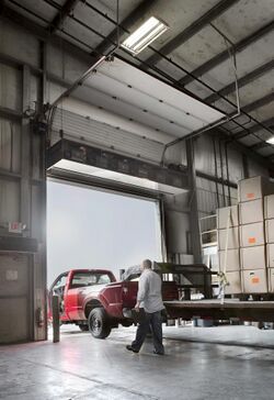 Industrial air curtain over open dock door