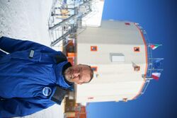 Chappellaz standing in front of an Antarctic research station