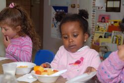 United States children eating at day care.jpg