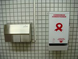 AIDS Prevention - Condom dispensers in toilets (4612444296).jpg