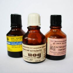 Three small bottles of medicine on a white background. The bottles are made of amber-colored glass and are labeled with text in the Cyrillic script.