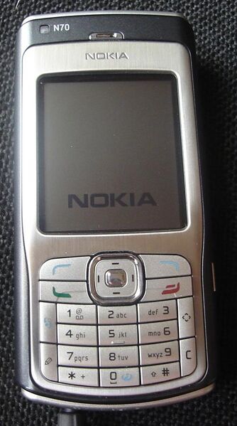 File:Nokia N70 with charger.jpg