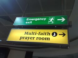 Multi-faith prayer room sign at London Heathrow Airport.jpg