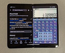 A black foldable smartphone running Wikipedia and another app