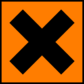 A square orange sticker with a black cross on it.