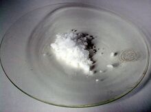 Solid sample of ammonium persulfate, as a white powder