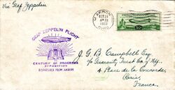 The front of an envelope. The consignee's address is in Paris. In the top-left corner, in cursive handwriting "By Graf Zeppelin". Beneath is a cachet stamped with purple ink, saying "Graf Zeppelin Flight to Century of Progress Exposition Dispatched from Akron" with an airship flying from right to left over an idealised futuristic city. Behind it sun-rays radiate. The postage stamp is green and says "United States Postage A Century of Progress Flight" with another right-to-left airship, this one flying between an airship hangar and a stylised skyscraper city. In white on a black elliptical background "50¢". The stamp is cancelled by wavy lines and the circular postmark says "4:30 am Oct 28 1933 Akron Ohio 3".